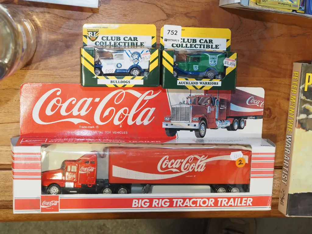 3 boxed die-cast model vehicles - 2 Australian Rugby League collector vehicles and a Coca Cola big rig Image 1++
