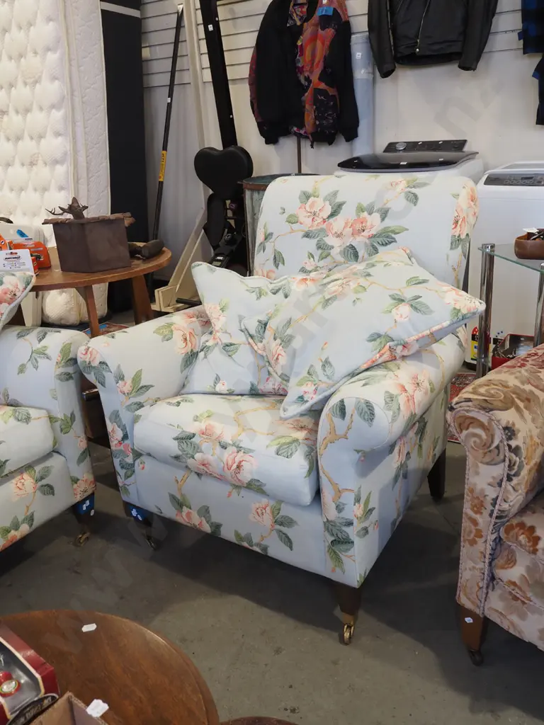 pair of magnolia floral armchairs with cushions and on brass casters Image 1++