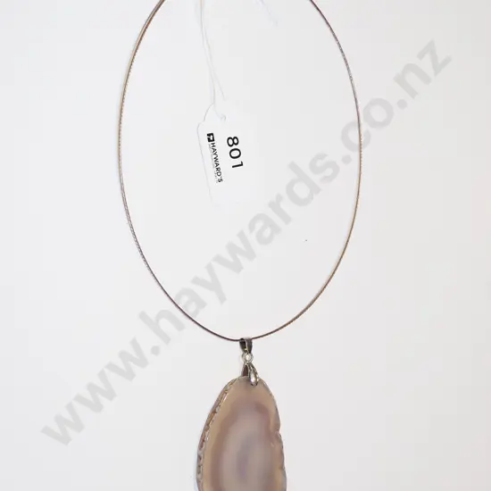 large polished stone on choker