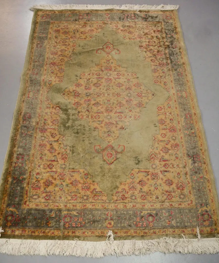 Persian-style floor rug, green ground w/ red & camel geometric & floral borders. Some fading & wear. Image 1++