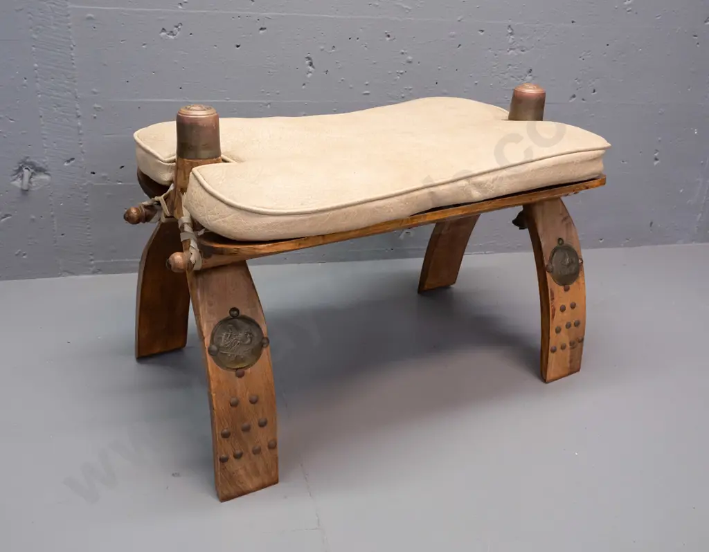 beech camel stool with lift off vinyl squab, Egyptian style applied brass caps and decoration Image 1++