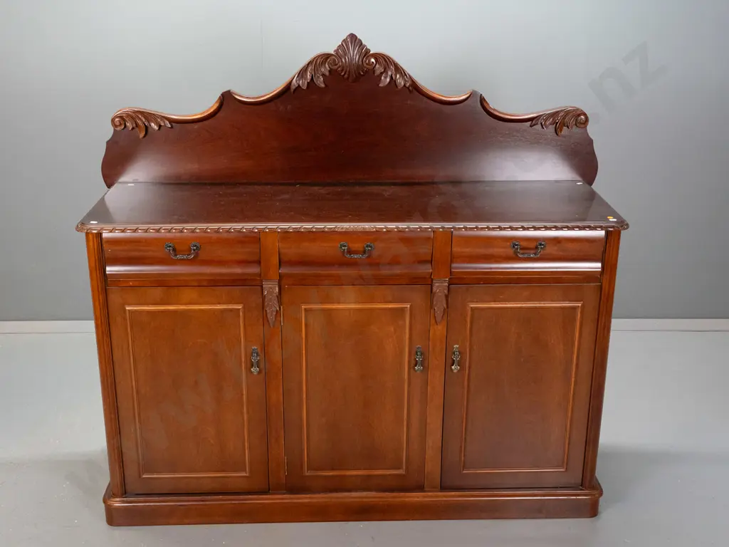 reproduction mahogany Victorian style carved-back sideboard with gadrooned top edge, 3 drawers above 3 panelled cupboard Image 1++