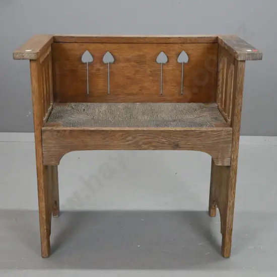 vintage oak arts & crafts style seat with slatted sides, pierced back, storage under lift-out woven seagrass seat -