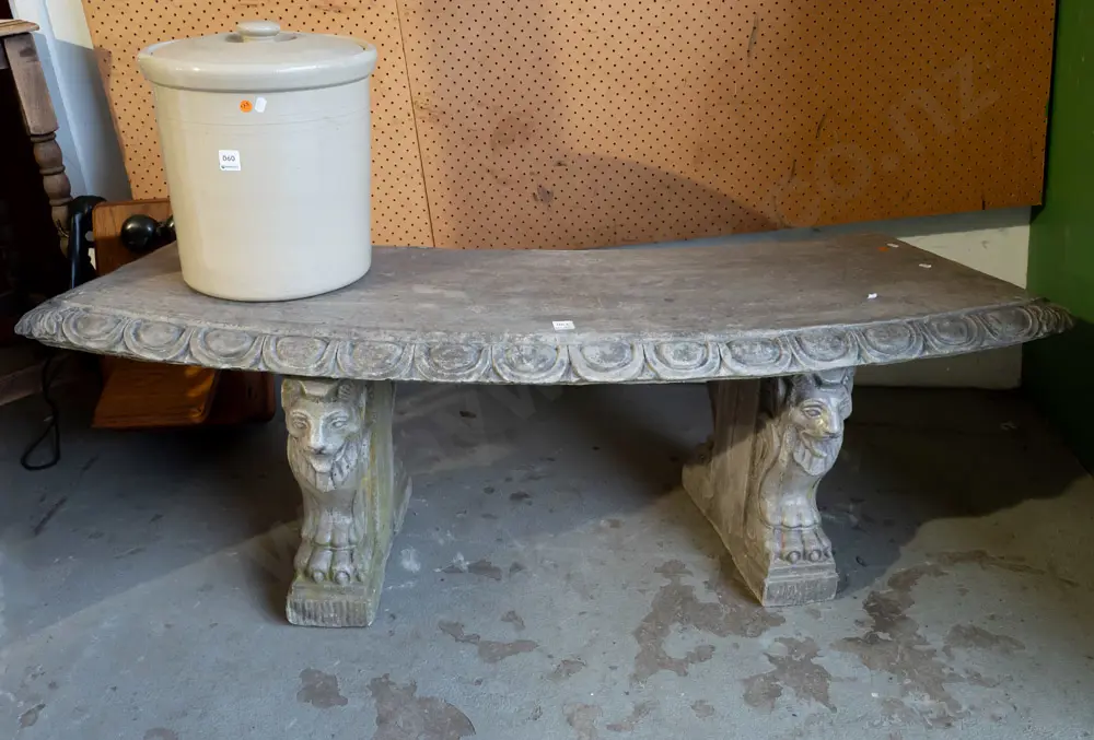 curved cast concrete/composite garden bench sitting on lion's head and paw supports, egg & dart moulding along seat top Image 1++