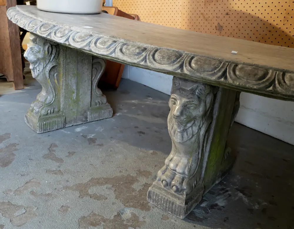 curved cast concrete/composite garden bench sitting on lion's head and paw supports, egg & dart moulding along seat top Image 1++