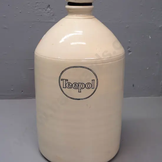 stoneware crock with Teepol branding, threaded stopper & rubber seal - has small chip on top rim and on stopper,