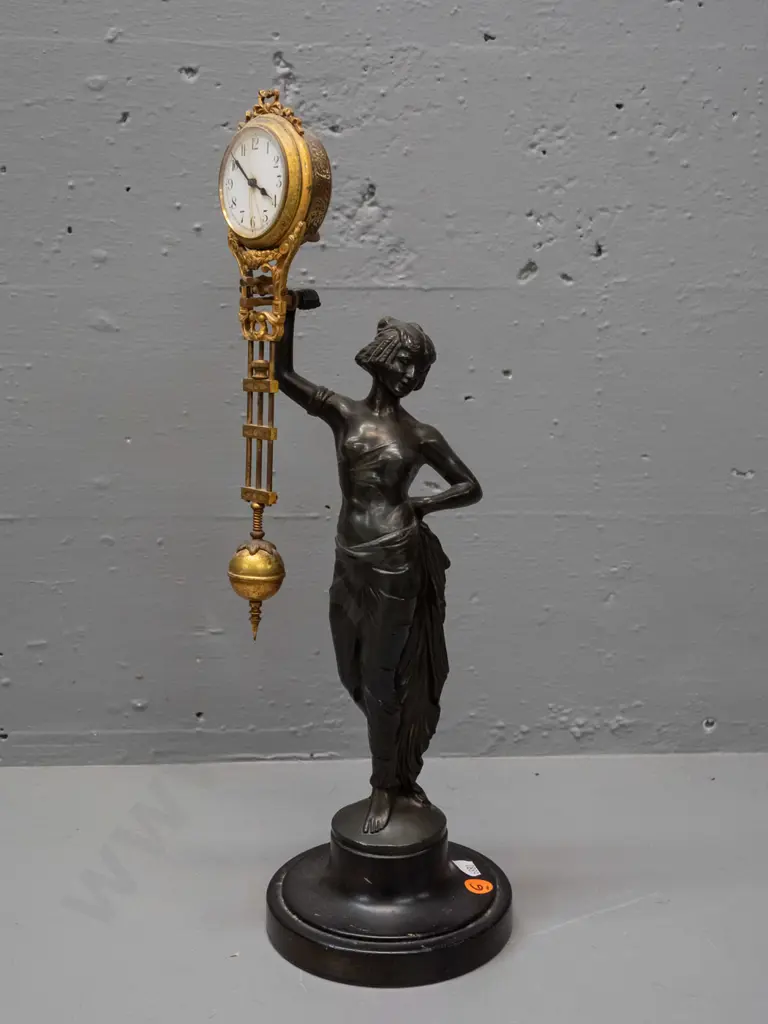 vintage mystery clock with figural cast spelter base, gilt finish over brass on ornate movement - base marked FJH and Image 1++