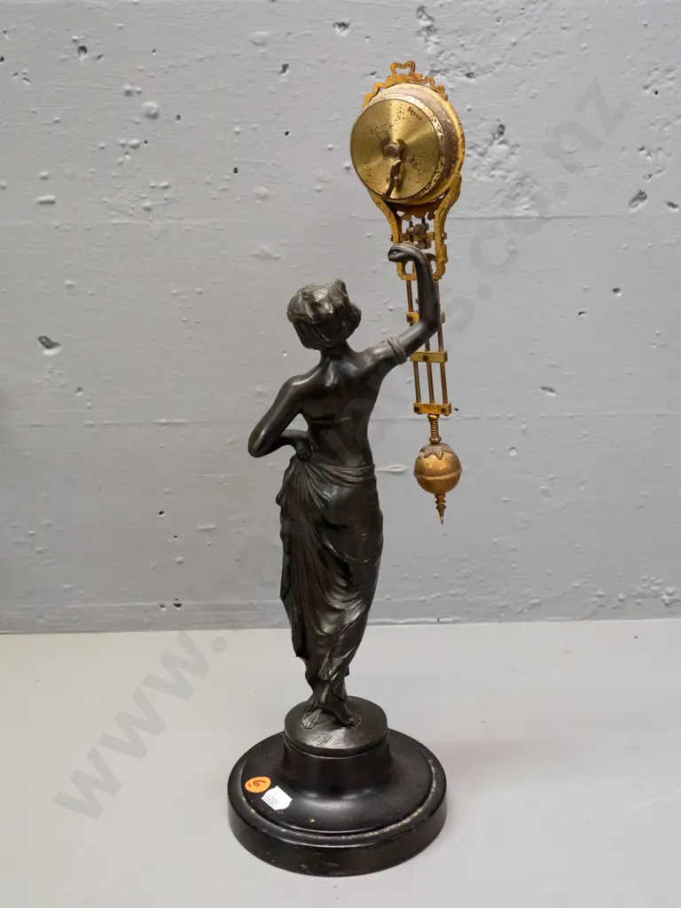 vintage mystery clock with figural cast spelter base, gilt finish over brass on ornate movement - base marked FJH and Image 1++
