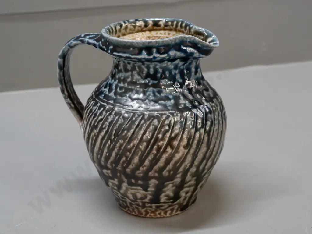 Mirek Smisek NZ studio pottery salt-glazed jug - with sunflower maker's mark below handle H-165 W-150 handle to spout Image 1++