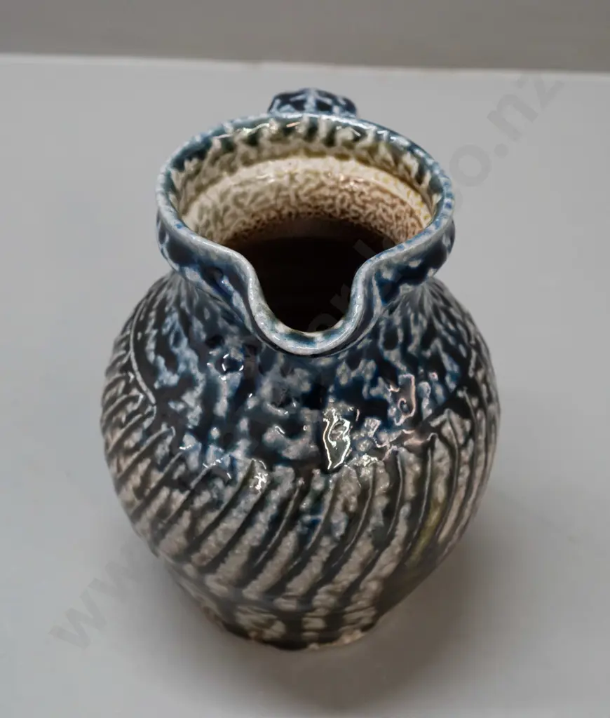 Mirek Smisek NZ studio pottery salt-glazed jug - with sunflower maker's mark below handle H-165 W-150 handle to spout Image 1++