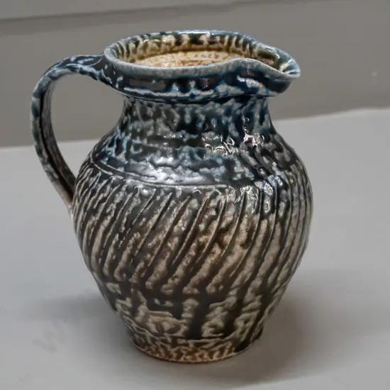 Mirek Smisek NZ studio pottery salt-glazed jug - with sunflower maker's mark below handle H-165 W-150 handle to spout
