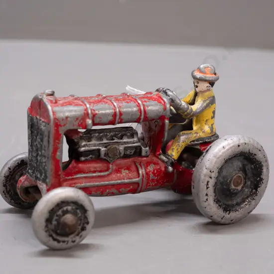 vintage Fun Ho cast alloy tractor with hollow metal wheels - looks like Model No 104 Fordson from Fun Ho website.