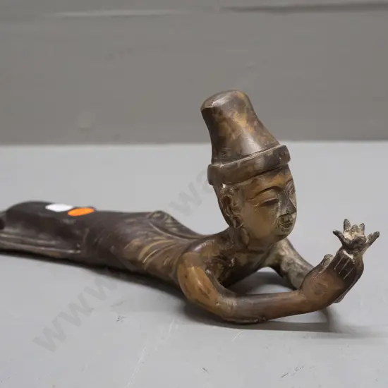 cast brass or bronze female figure stretched out holding lotus flower - uneven patination H-90 L-280
