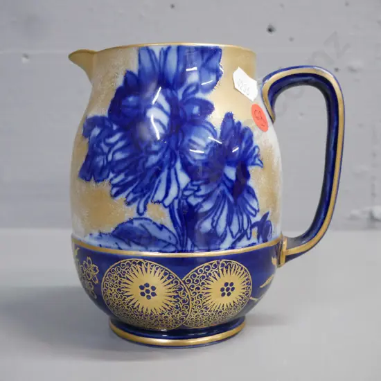 Royal Dalton iris pattern jug, gilded decoration, crazing inside H-145 D-140