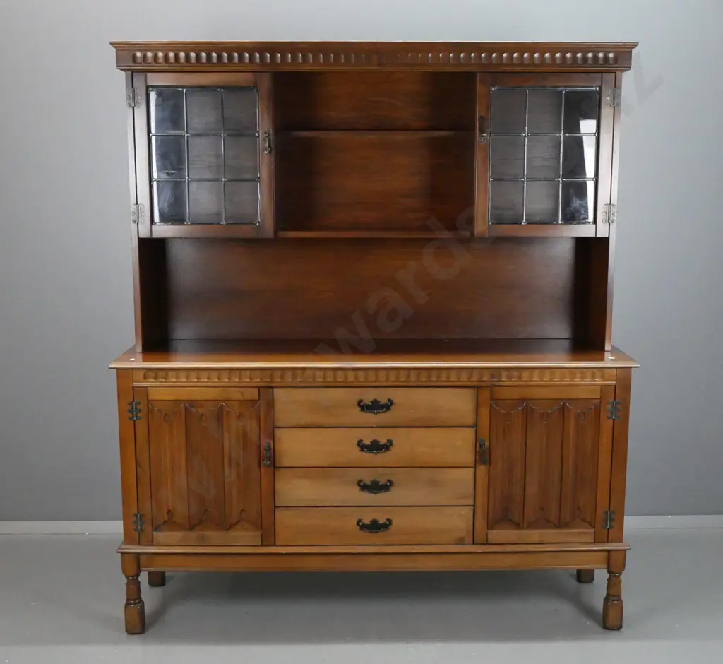 arts and crafts style oak veneer and beech sideboard with shaped moulded cornice above 2 glazed leadlight cupboard Image 1++