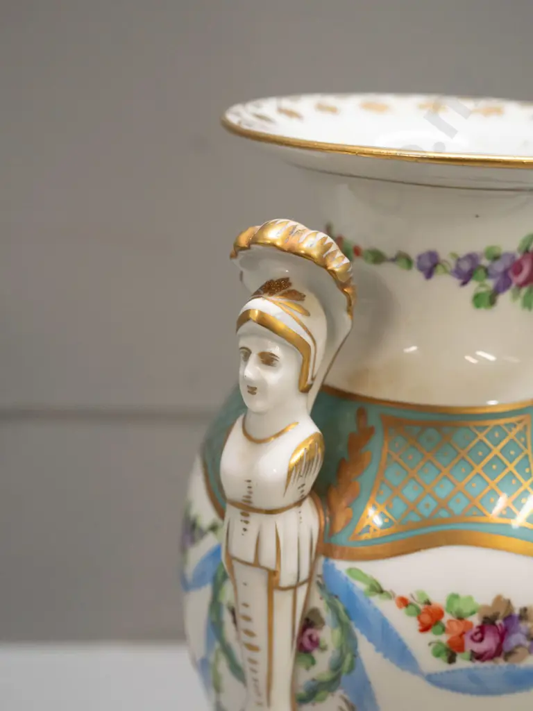 porcelain handled urn vase with figural handles, gilt & floral decoration, on sqaure base, marked "Made In Germany East" Image 1++
