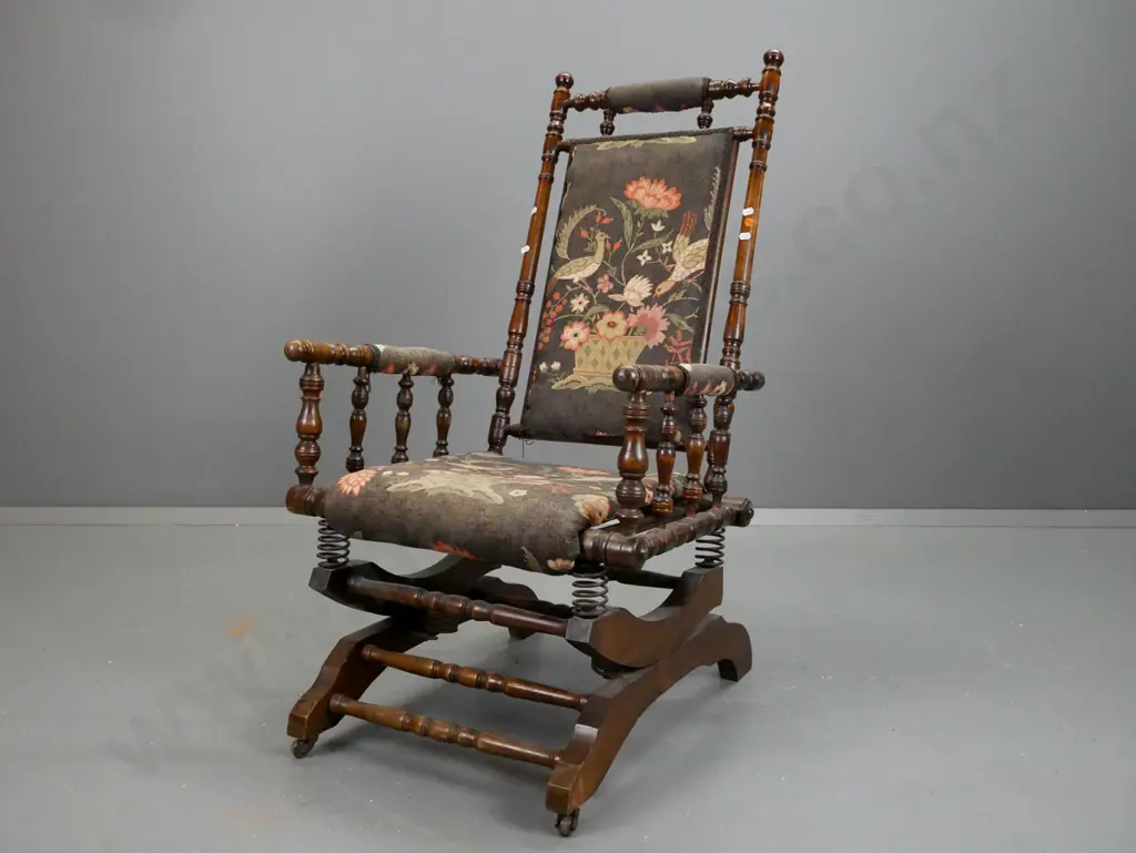 Dexter rocker with turned rails and supports, upholstered seat and back, spring mechanism is working Image 1++