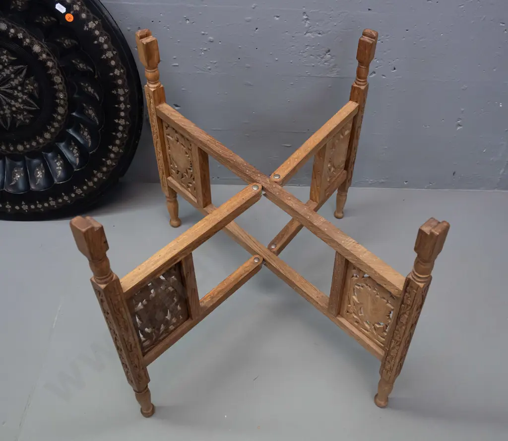 etched metal tole-ware tray on folding pierced and carved timber 4-legged base stamped Made in India. Some wear to black Image 1++