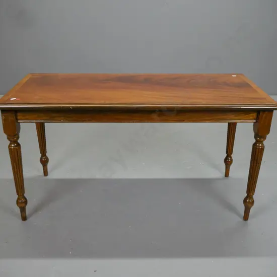 reproduction Regency style beech coffee table with turned and fluted legs, flame mahogany & cross banded walnut veneer