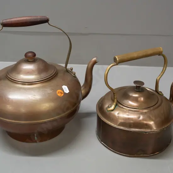 2 vintage copper plated kettles / teapots with brass handles - one with wooden handle and knob marked M.L.P. Chch