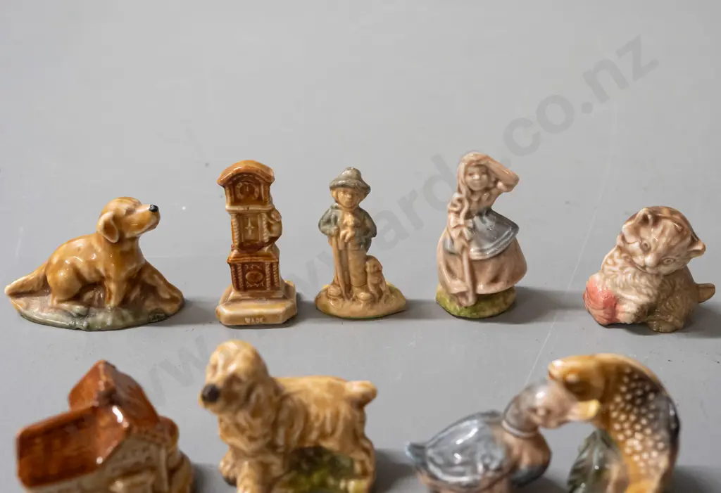 9 assorted Wade whimsies, some marked Wade - clock, dogs, duck, Jack Moxx cottage with small chip in base Image 1++