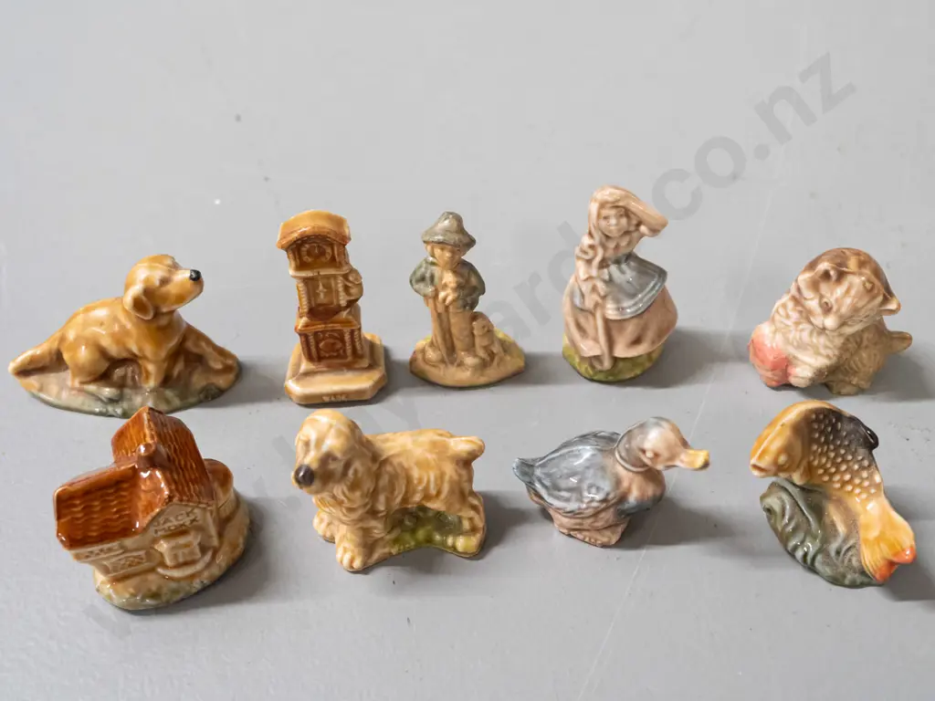 9 assorted Wade whimsies, some marked Wade - clock, dogs, duck, Jack Moxx cottage with small chip in base Image 1++