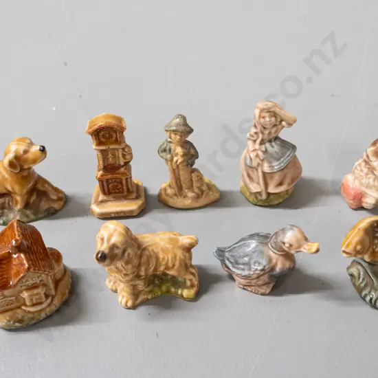 9 assorted Wade whimsies, some marked Wade - clock, dogs, duck, Jack Moxx cottage with small chip in base