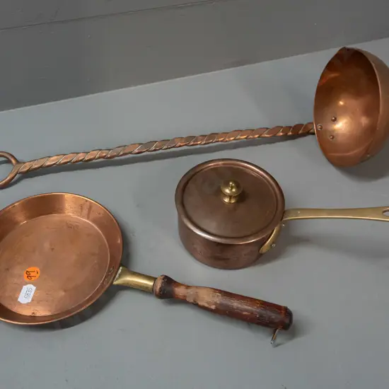 3 copper items - ladle with twisted and beaten stem, small copper fry pan with wooden handle and brass fitting, copper