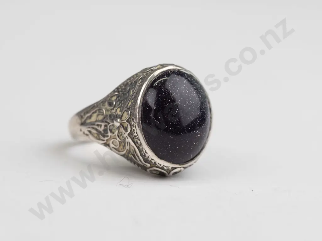 silver ring with dark speckle stone stamped stg size L Image 1++