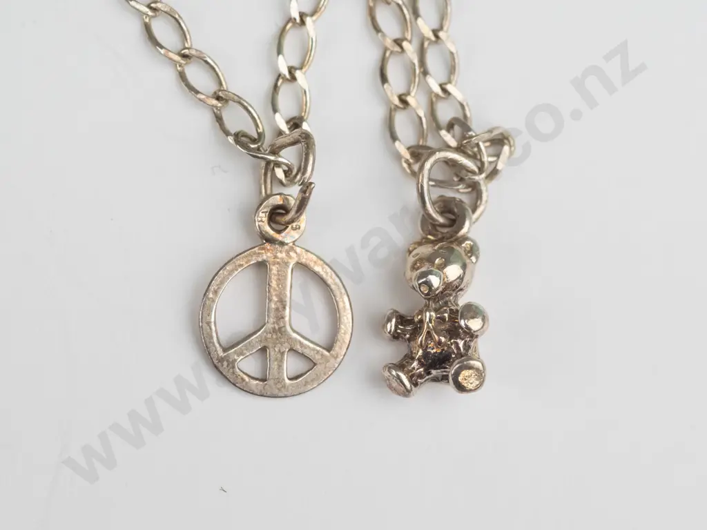 silver charm bracelet stamped 925 with teddy bear & peace sign charm Image 1++