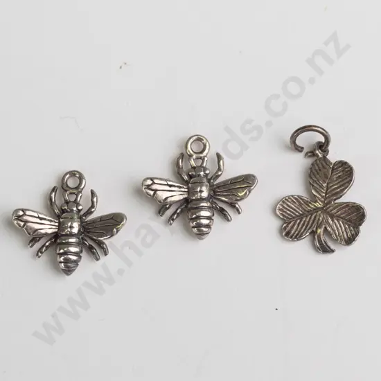 pair of silver bug charms & silver clover charm all stamped