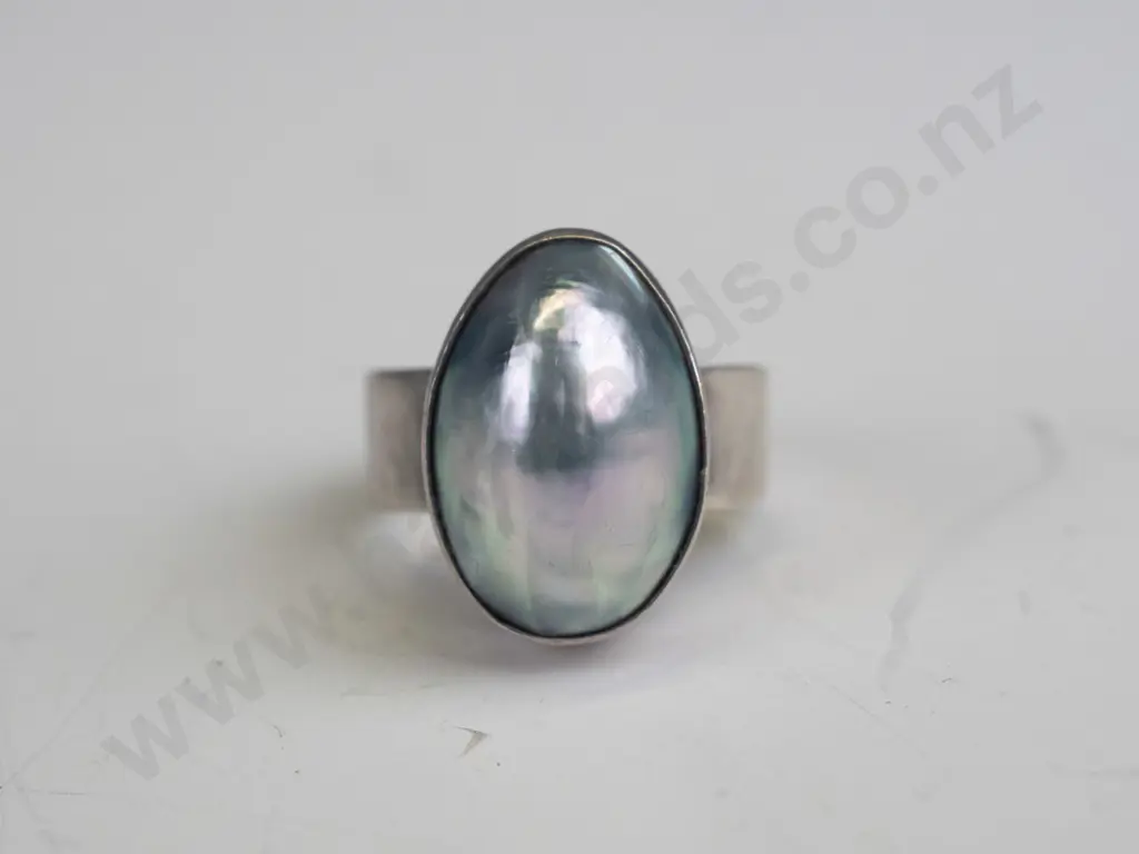 silver ring with milky stone stamped 925 size Q Image 1++