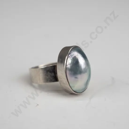 silver ring with milky stone stamped 925 size Q