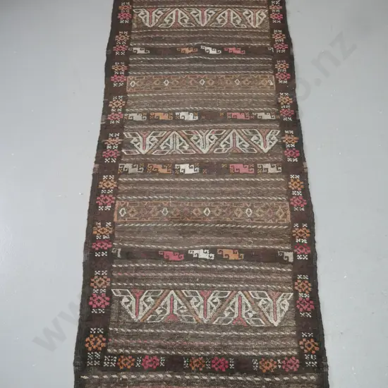 hand-knotted wool tribal pattern floor rug in browns and reds - fading and fringe is worn on both ends L-1860 W-670
