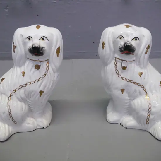 Pair of Staffordshire spaniels white body gilt decoration H-180 W-140 [crazing to body of both, chip to base & star