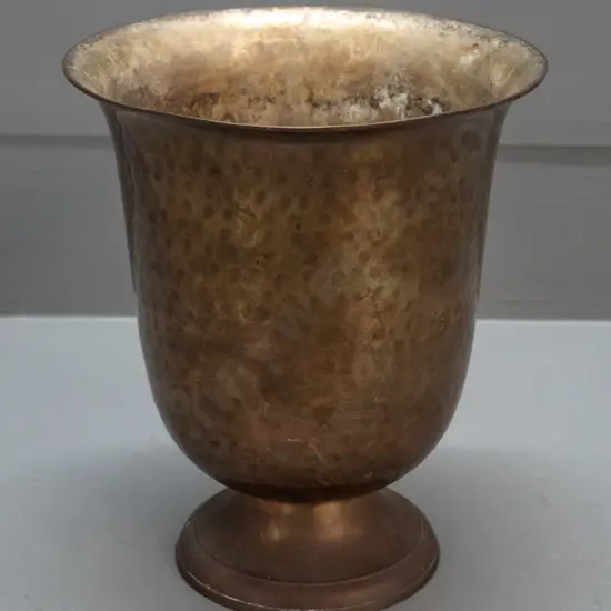 hammered cast brass goblet shaped urn vase - dent to base, some corrosion inside H-220 D-180 at top.