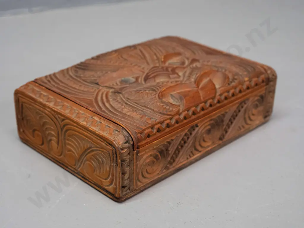 carved native timber trinket box with Maori motif carving, paua inset eyes, hinged lid H-45 W-170 D-110 Image 1++
