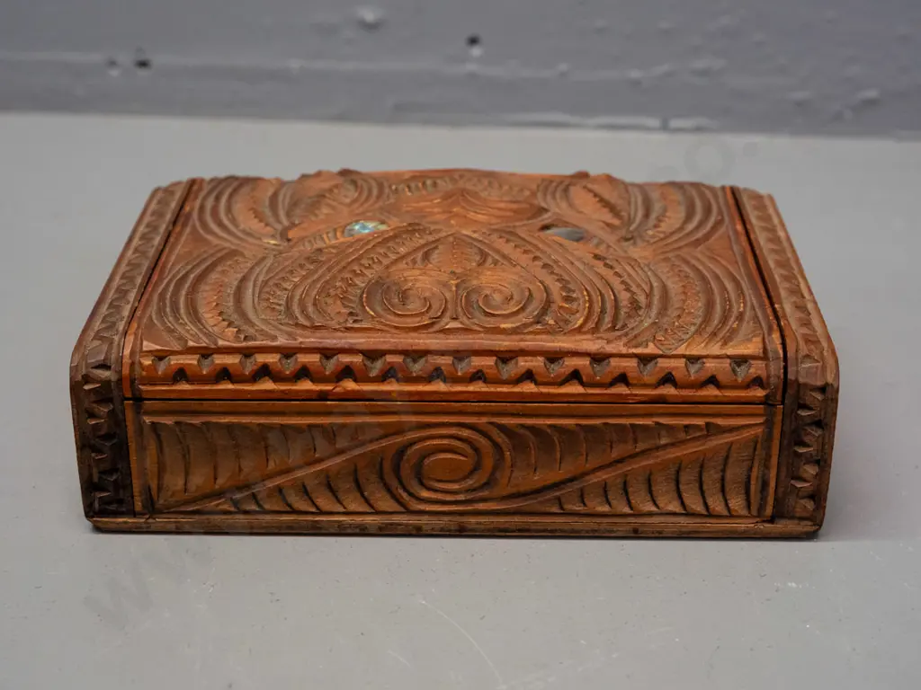 carved native timber trinket box with Maori motif carving, paua inset eyes, hinged lid H-45 W-170 D-110 Image 1++