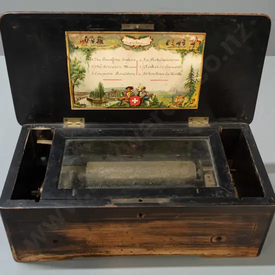Victorian music box in restorer's condition - inlaid box with brass music mechanism, glazed panel, handwritten song list