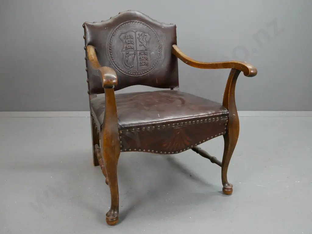 oak fireside chair with sweeping arms on cabriole and ball legs with turned supports. Leather seat Image 1++