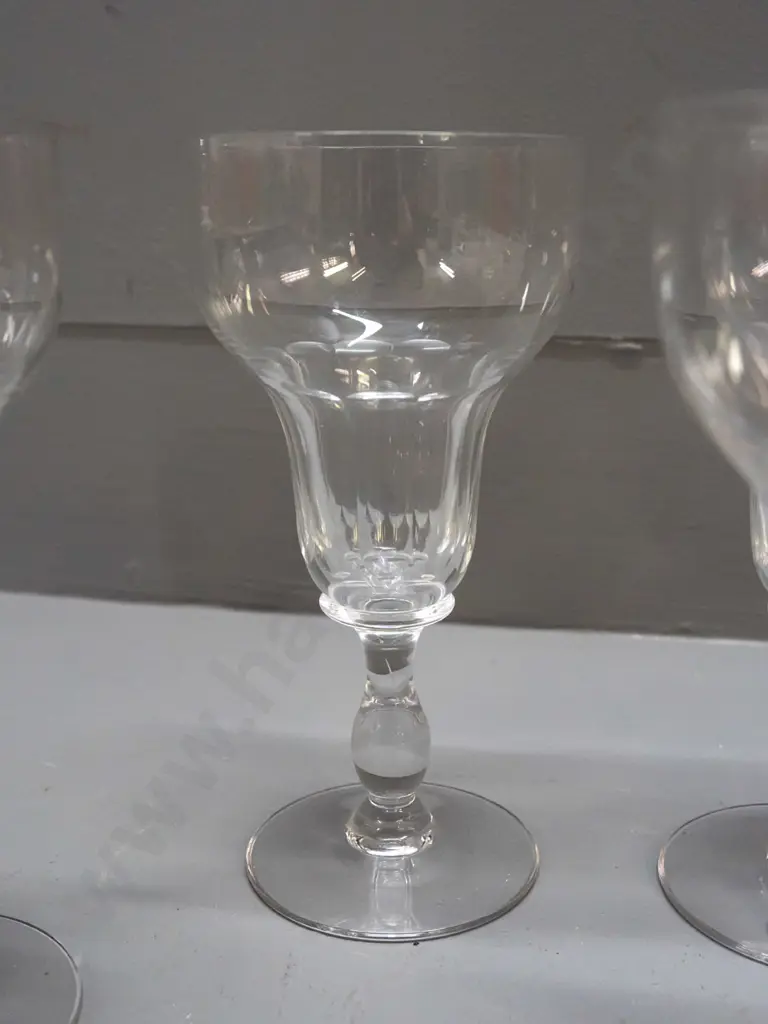 7 glass items - Stuart crystal goblet, 2 small handled & footed liquers, one with etched band, and 4 other stemmed Image 1++