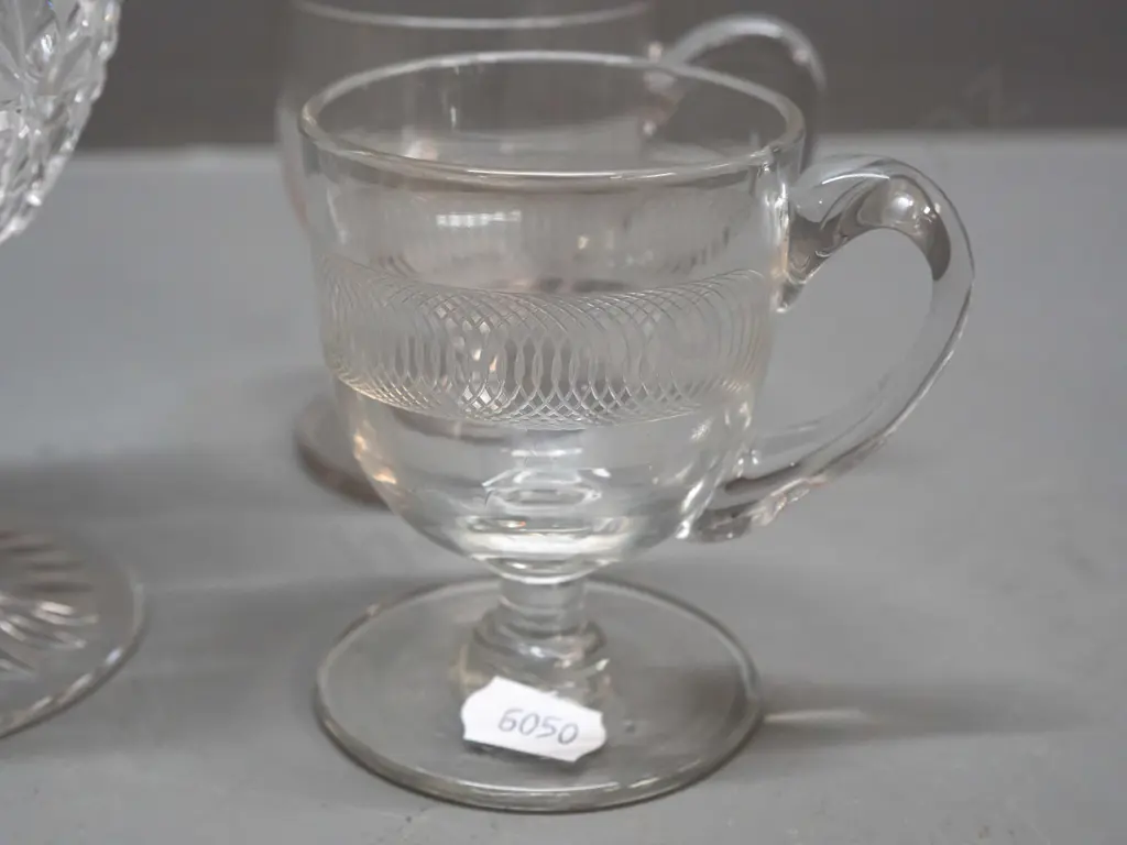 7 glass items - Stuart crystal goblet, 2 small handled & footed liquers, one with etched band, and 4 other stemmed Image 1++