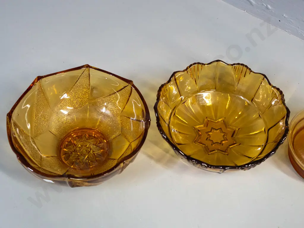 3 pieces of amber glass - stoppered decanter and 2 moulded salad bowls. Decanter has tiny nick in rim, some staining Image 1++
