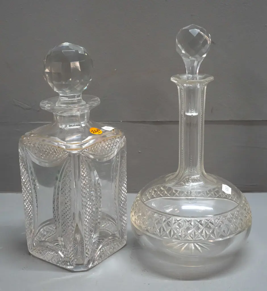 2 stoppered crystal decanters - squat round H-265 and a heavy square design with etched diamond pattern corners H-250 Image 1++