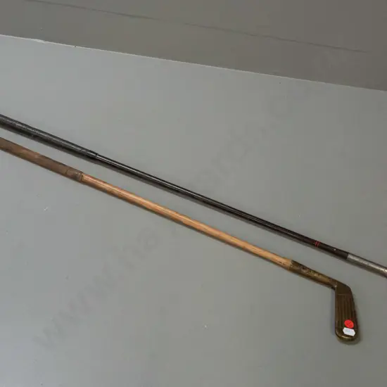 2 vintage golf clubs / putters - one with brass head and hickory handle, other marked Forgan St. Andrews Gold Medal,