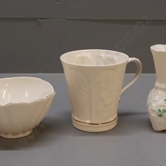 3 small pieces of Belleek pottery - mug and bowl with gilt decoration and a vase with woven texture H-110