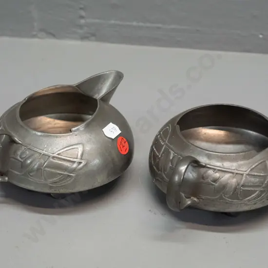English pewter cream and sugar - Archibald Knox design with nouveau style whiplash decoration - reg. no 0231 marked on
