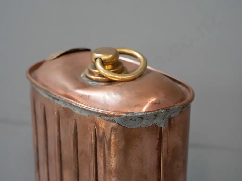 copper and brass hot water bottle / warmer with ribbed sides, threaded cap, "Fill Warmer Quite Full" plaque - has a dent Image 1++