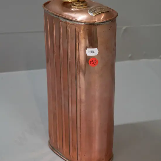 copper and brass hot water bottle / warmer with ribbed sides, threaded cap, "Fill Warmer Quite Full" plaque - has a dent