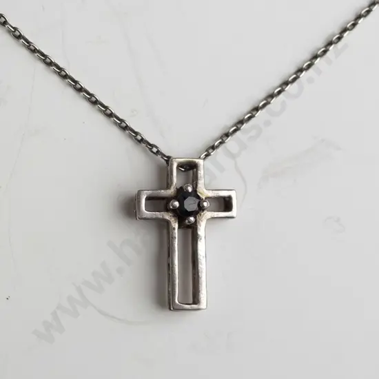 silver cross with dark stone stamped 925
